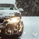 black car on snow covered road during daytime
